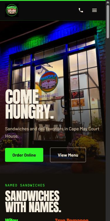 Knuckle Sandwich Deli website on a phone